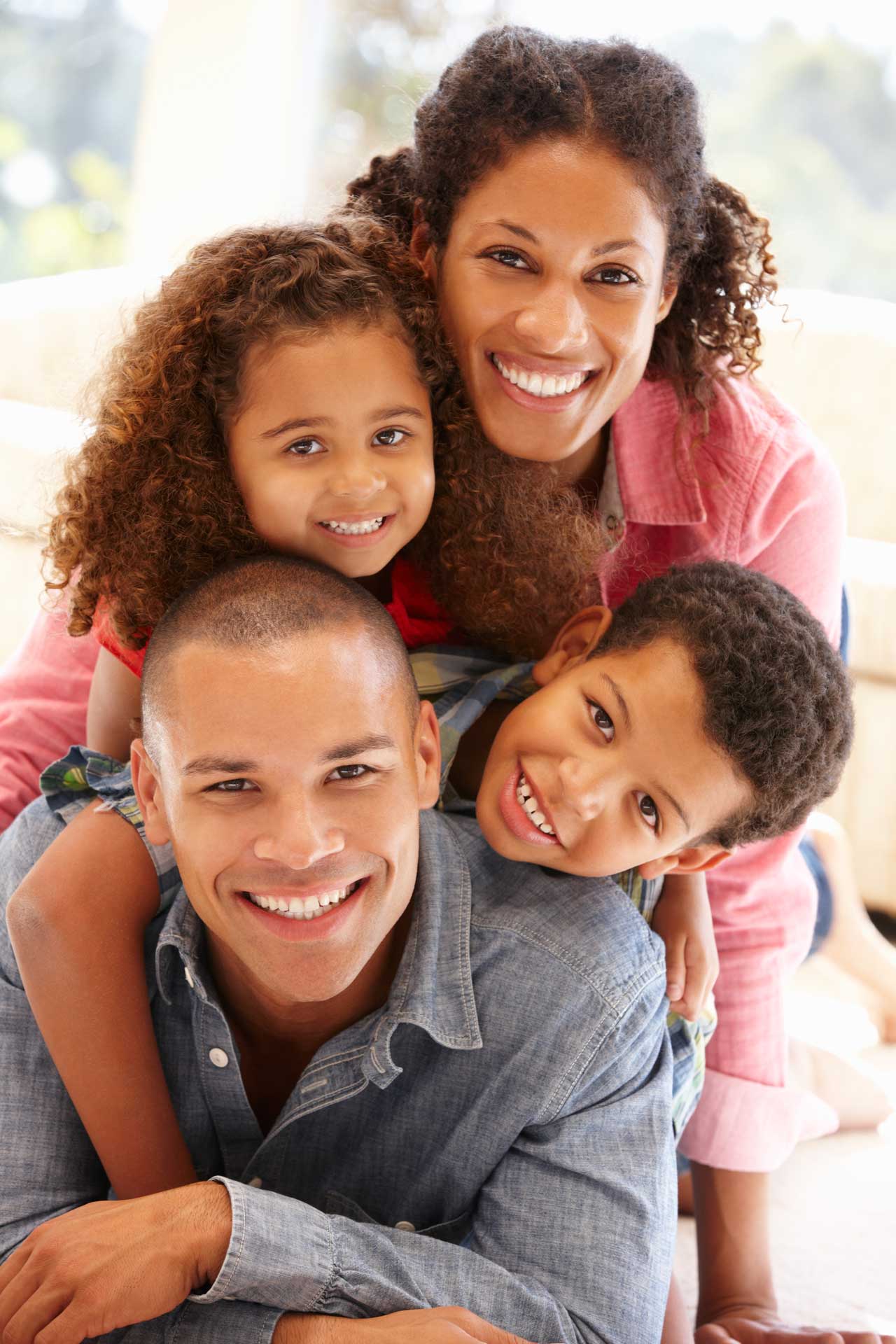 family-smiling-camera